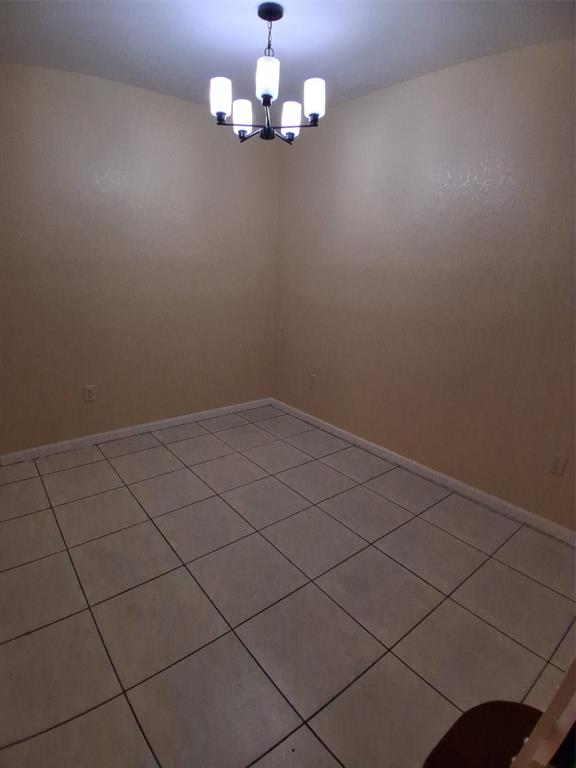 1425 Southeast 24th Court Homestead, FL 33035 - Photo 9 of 29 en view of empty room with wooden floor