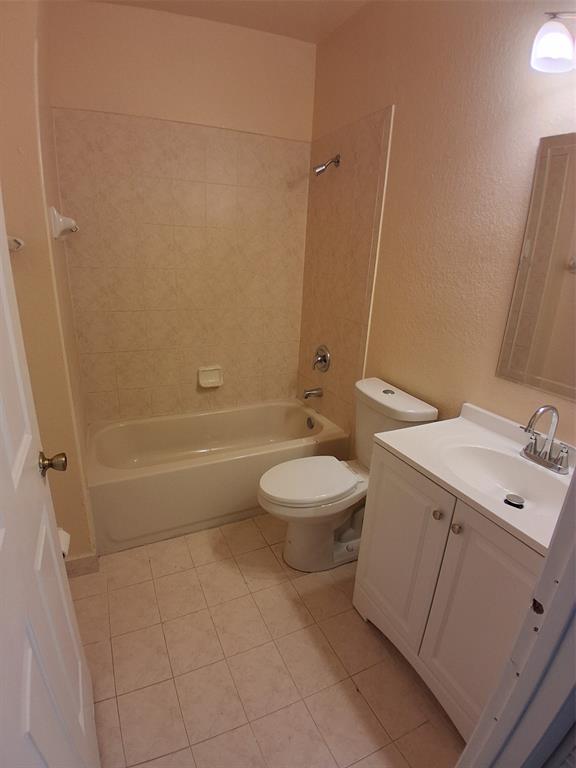 1425 Southeast 24th Court Homestead, FL 33035 - Photo 10 of 29 a bathroom with a toilet sink and mirror