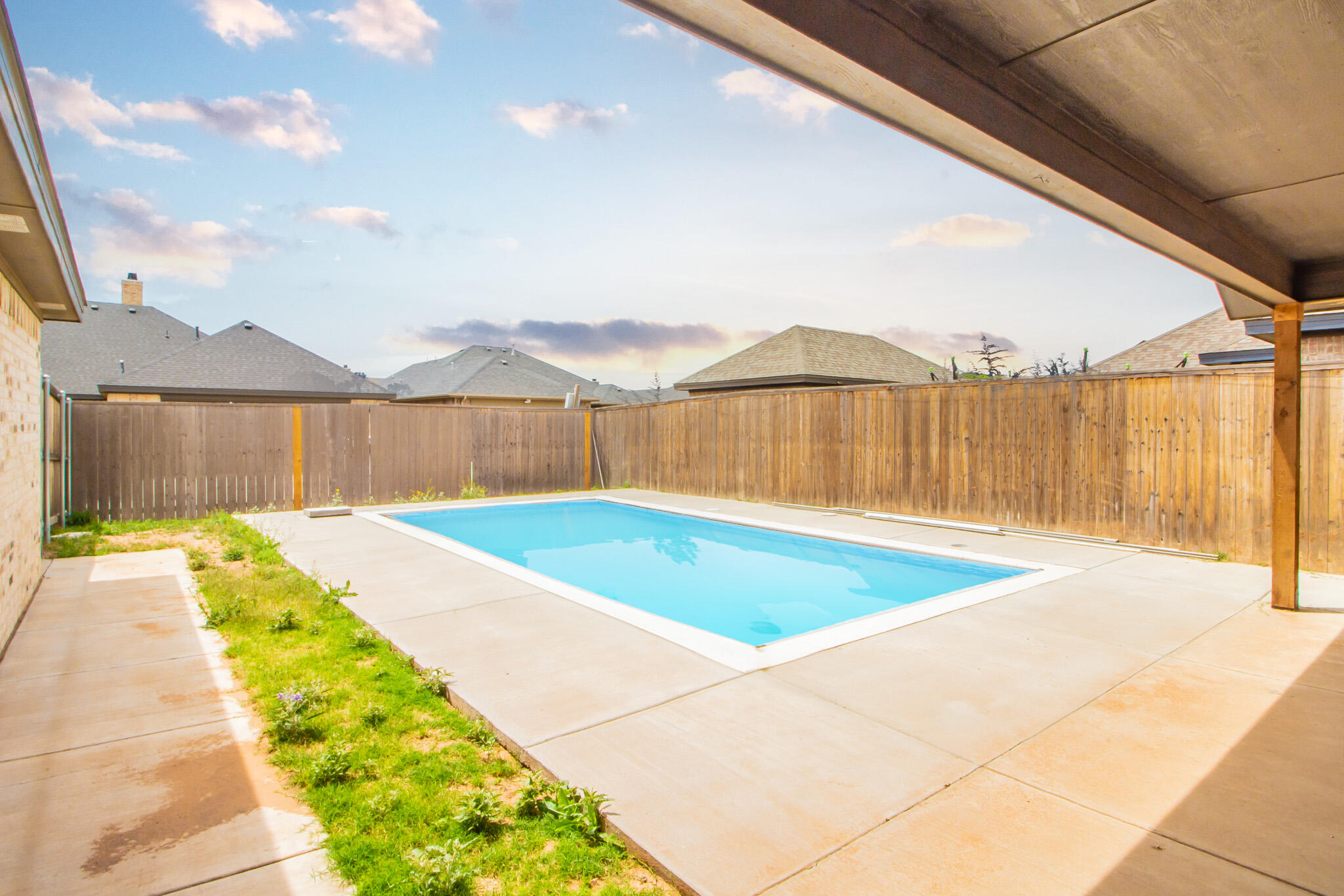7801 56th Street Lubbock, TX 79407 - Photo 3 of 29 a view of swimming pool with a lake view
