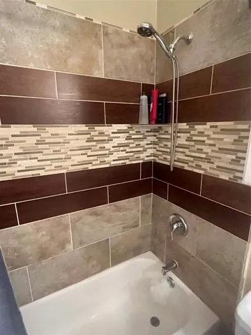 a bathroom with a sink and a shower