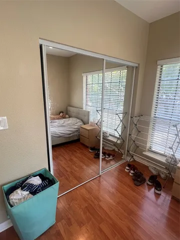 a bedroom with furniture and a window