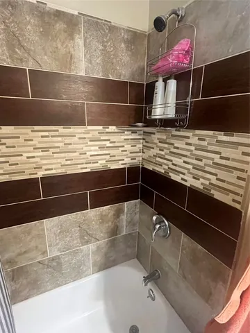 a bathroom with a sink and a shower
