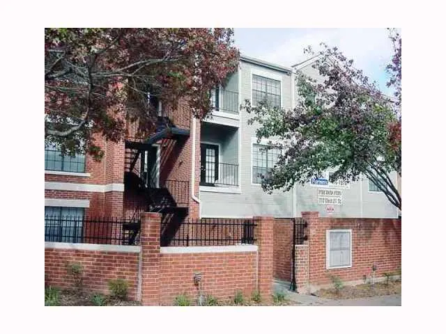 a view of a house with a tree
