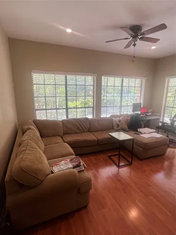 a living room with furniture and a large window