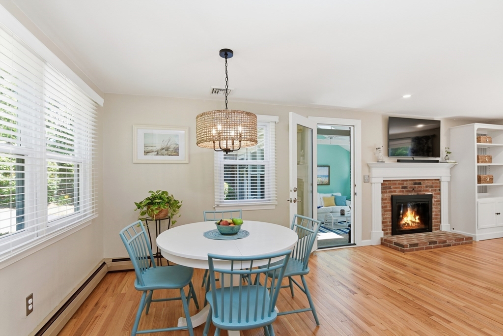 8 Emerald Way Sandwich, MA 02644 - Photo 10 of 36 a view of a dining room with furniture window and wooden floor