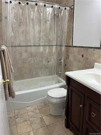a bathroom with a sink a toilet and bathtub