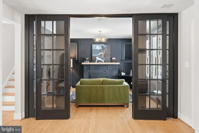 a work room with furniture and a potted plant