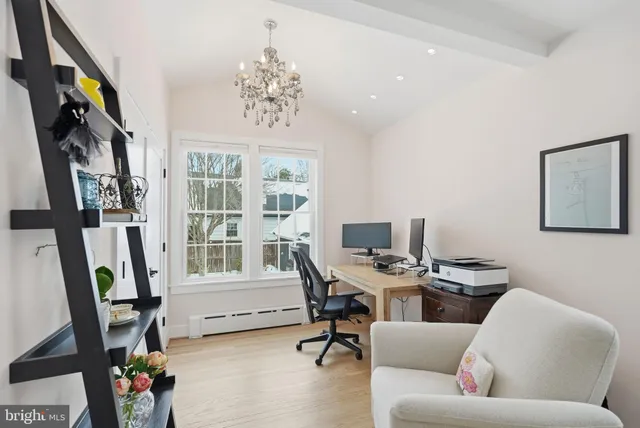 a bathroom with a granite countertop sink a toilet a mirror and shower