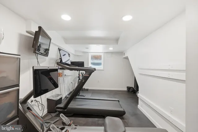 a view of a house with backyard porch and sitting area