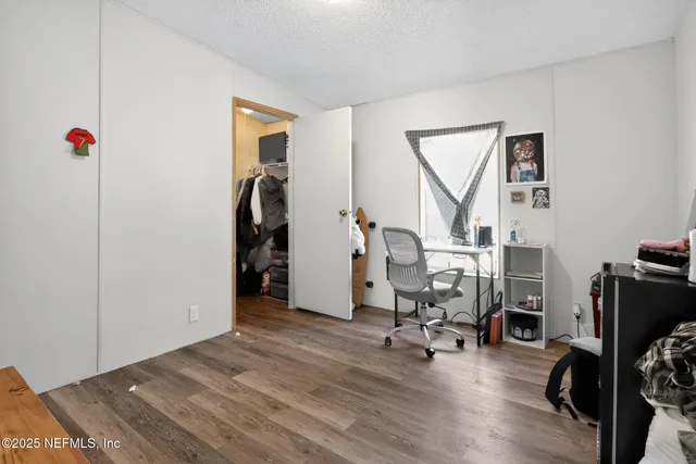 a view of a livingroom with gym equipment
