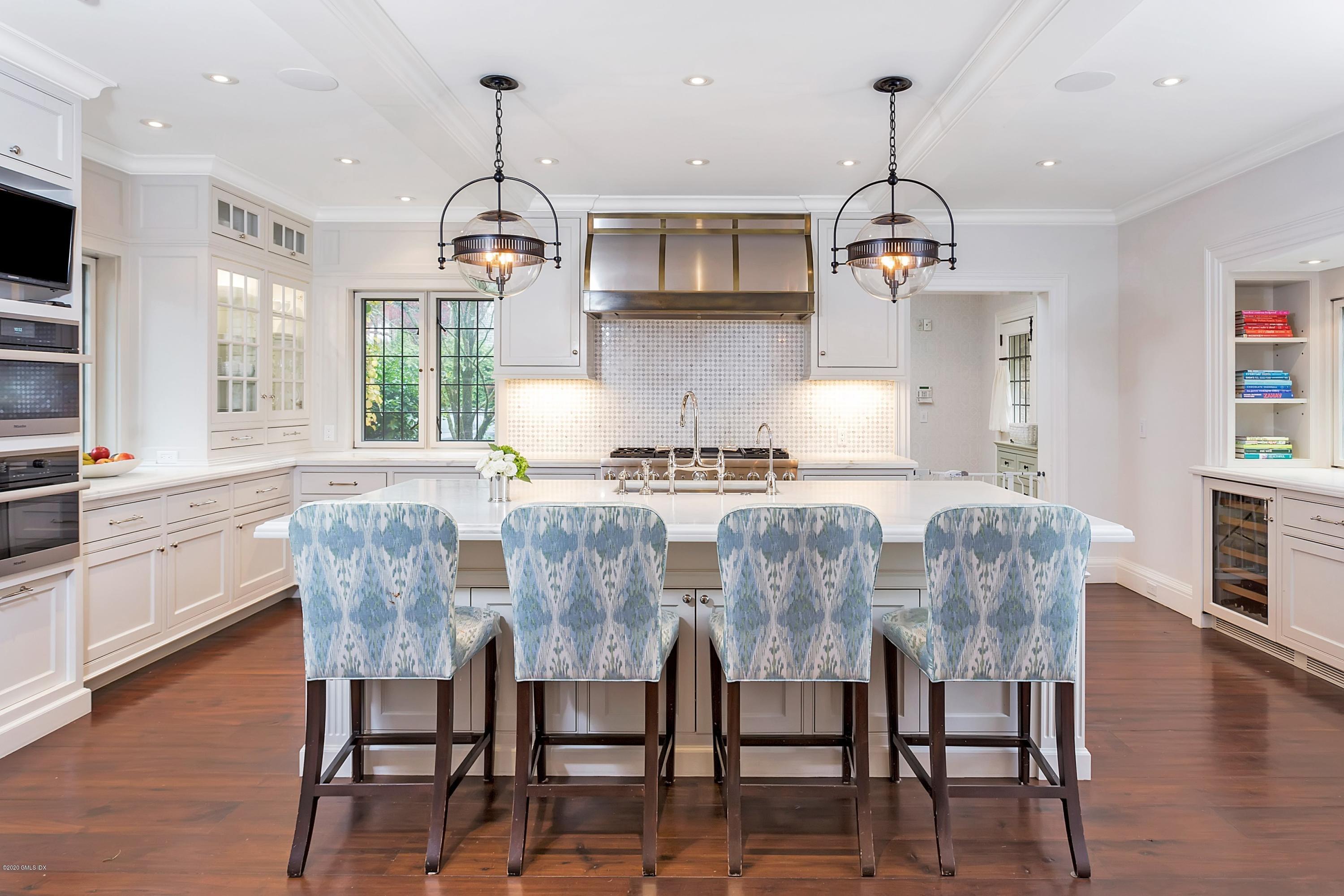 2 Broad Road Greenwich, CT 06830 - Photo 12 of 39 a view of dining room and kitchen with furniture wooden floor