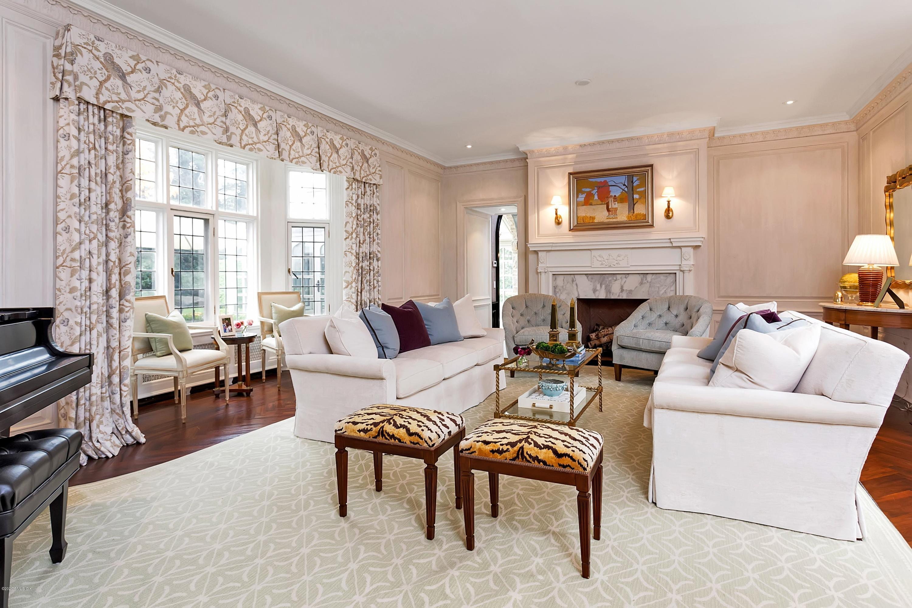 2 Broad Road Greenwich, CT 06830 - Photo 17 of 39 a living room with furniture and a fireplace