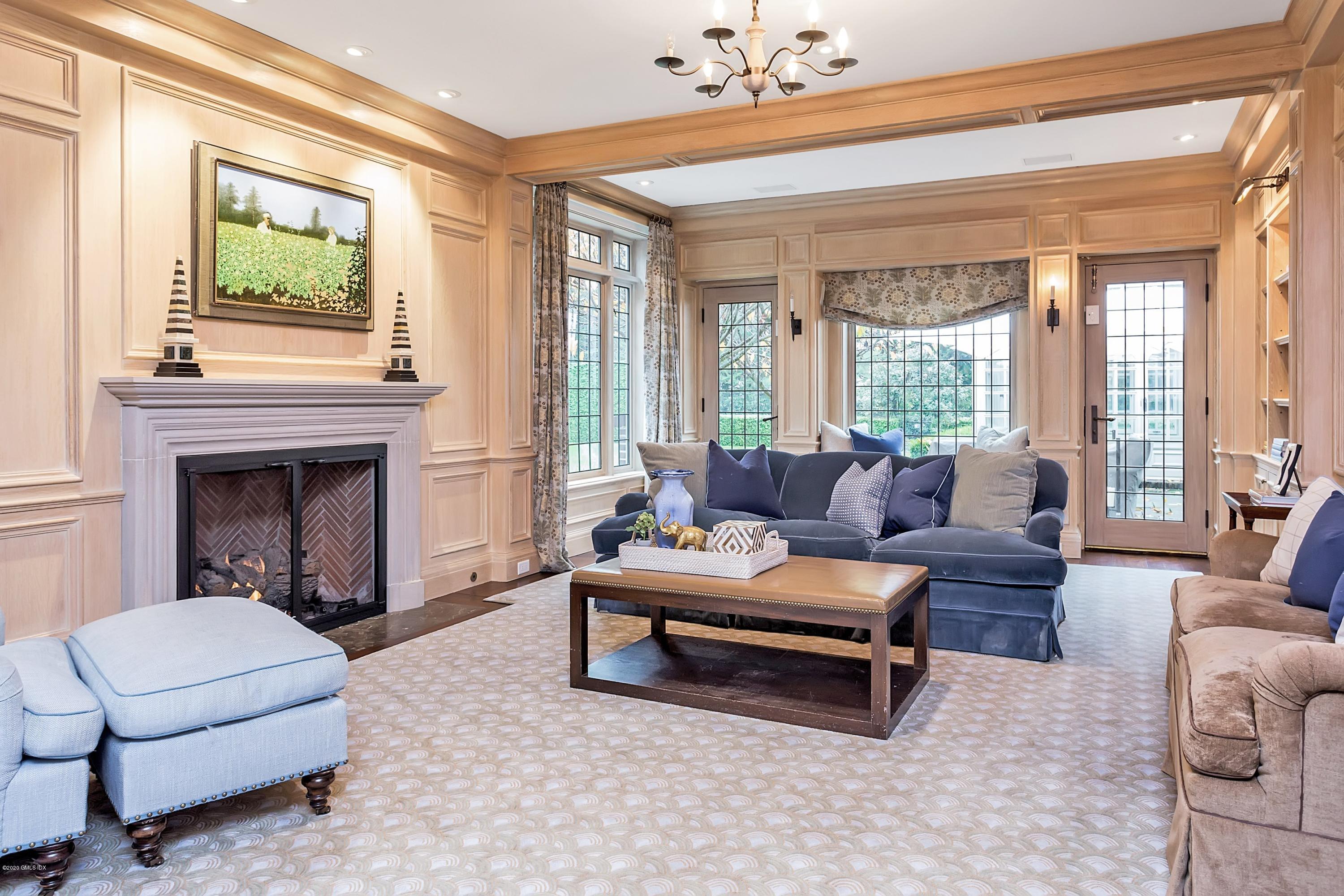 2 Broad Road Greenwich, CT 06830 - Photo 20 of 39 a living room with furniture and a fireplace