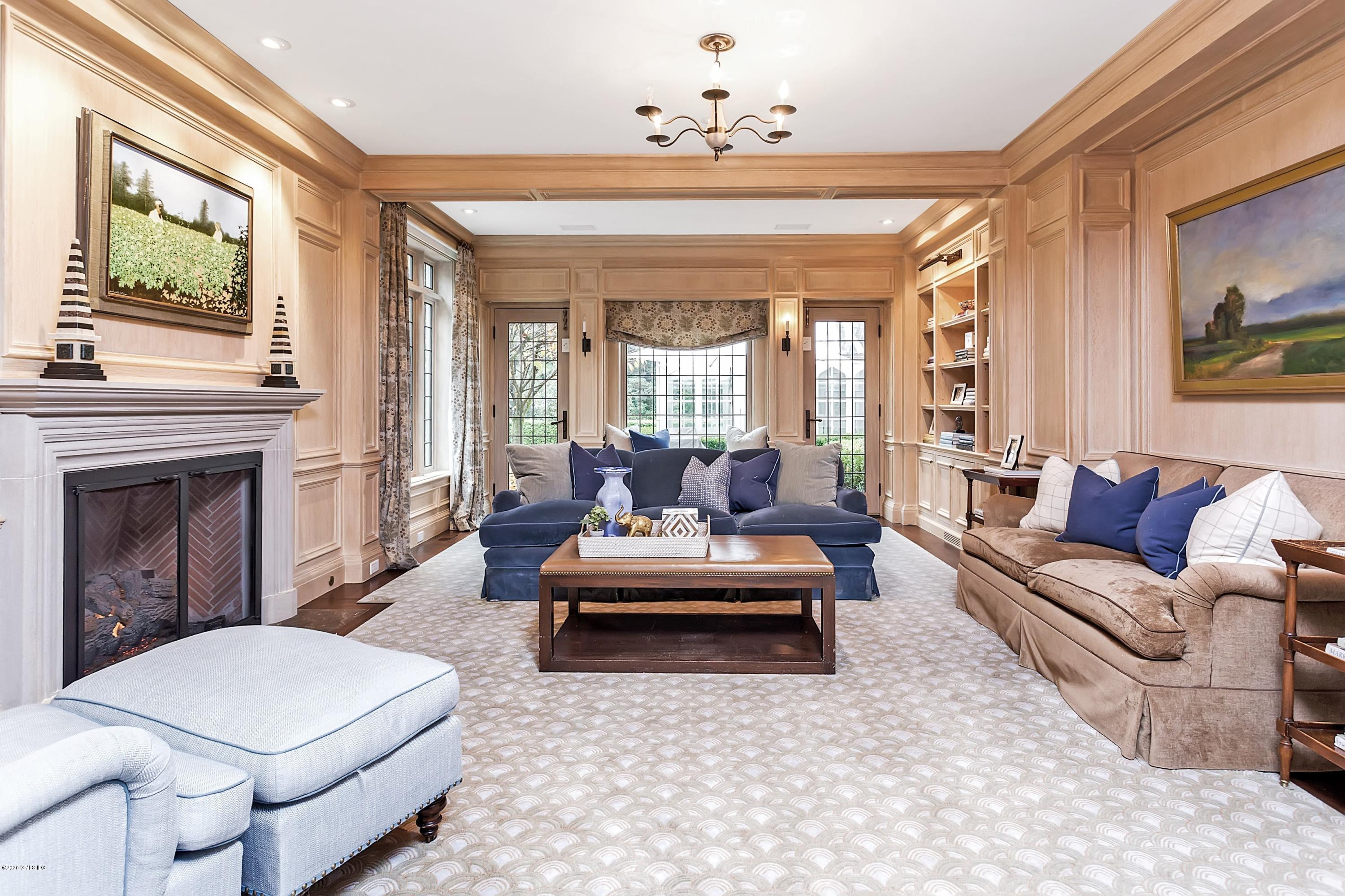 2 Broad Road Greenwich, CT 06830 - Photo 21 of 39 a living room with furniture and a fireplace