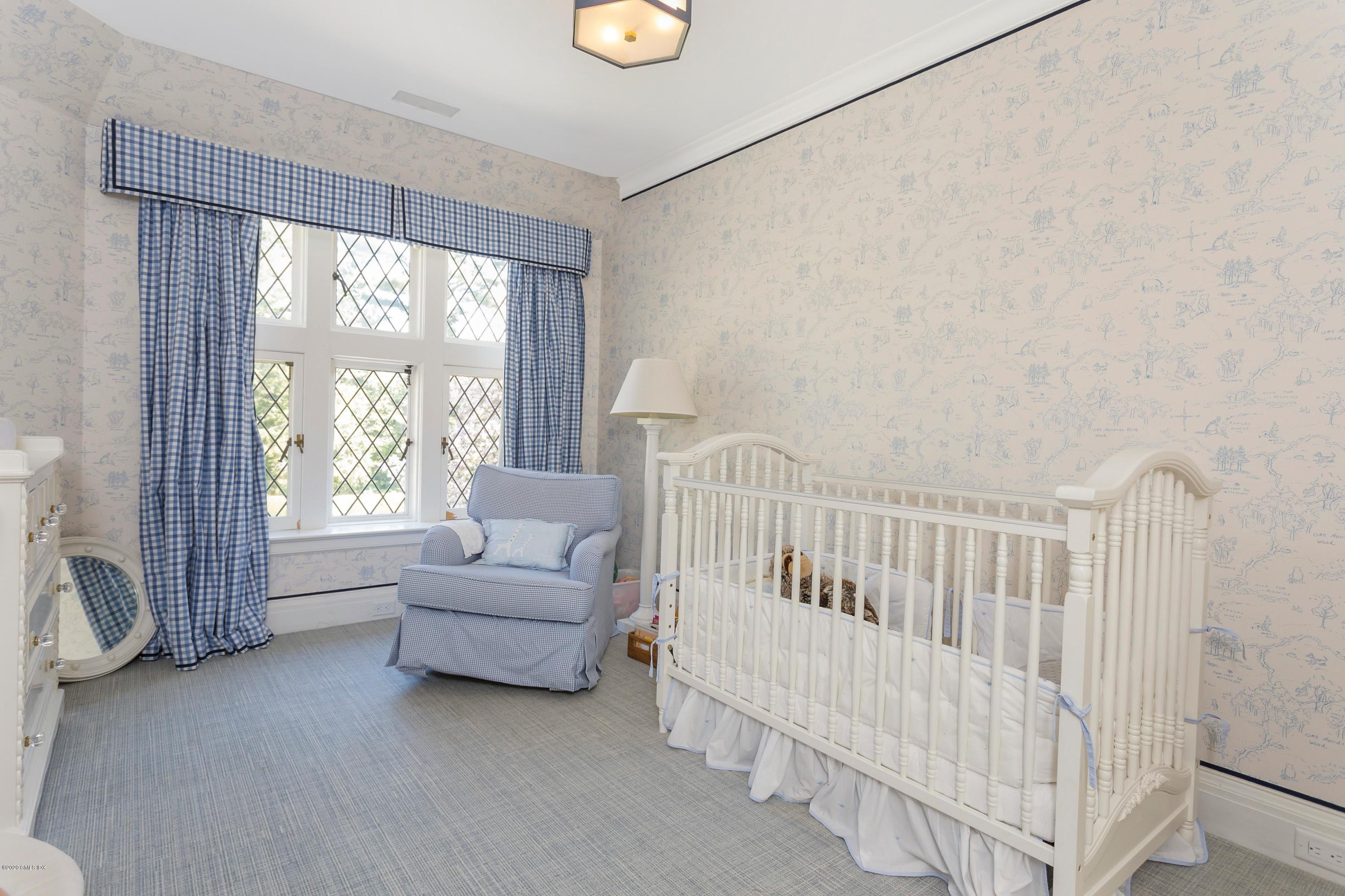 2 Broad Road Greenwich, CT 06830 - Photo 27 of 39 a living room with furniture and a large window