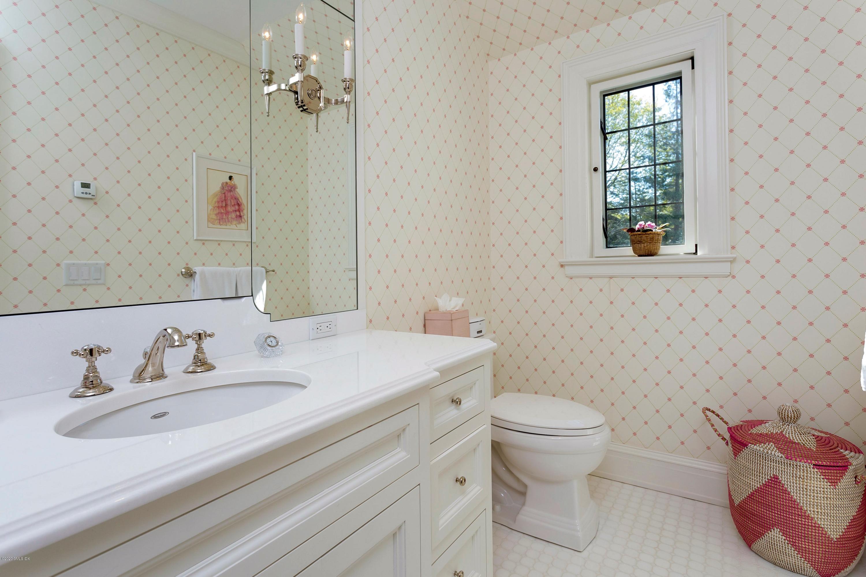 2 Broad Road Greenwich, CT 06830 - Photo 28 of 39 a bathroom with a sink toilet and a mirror