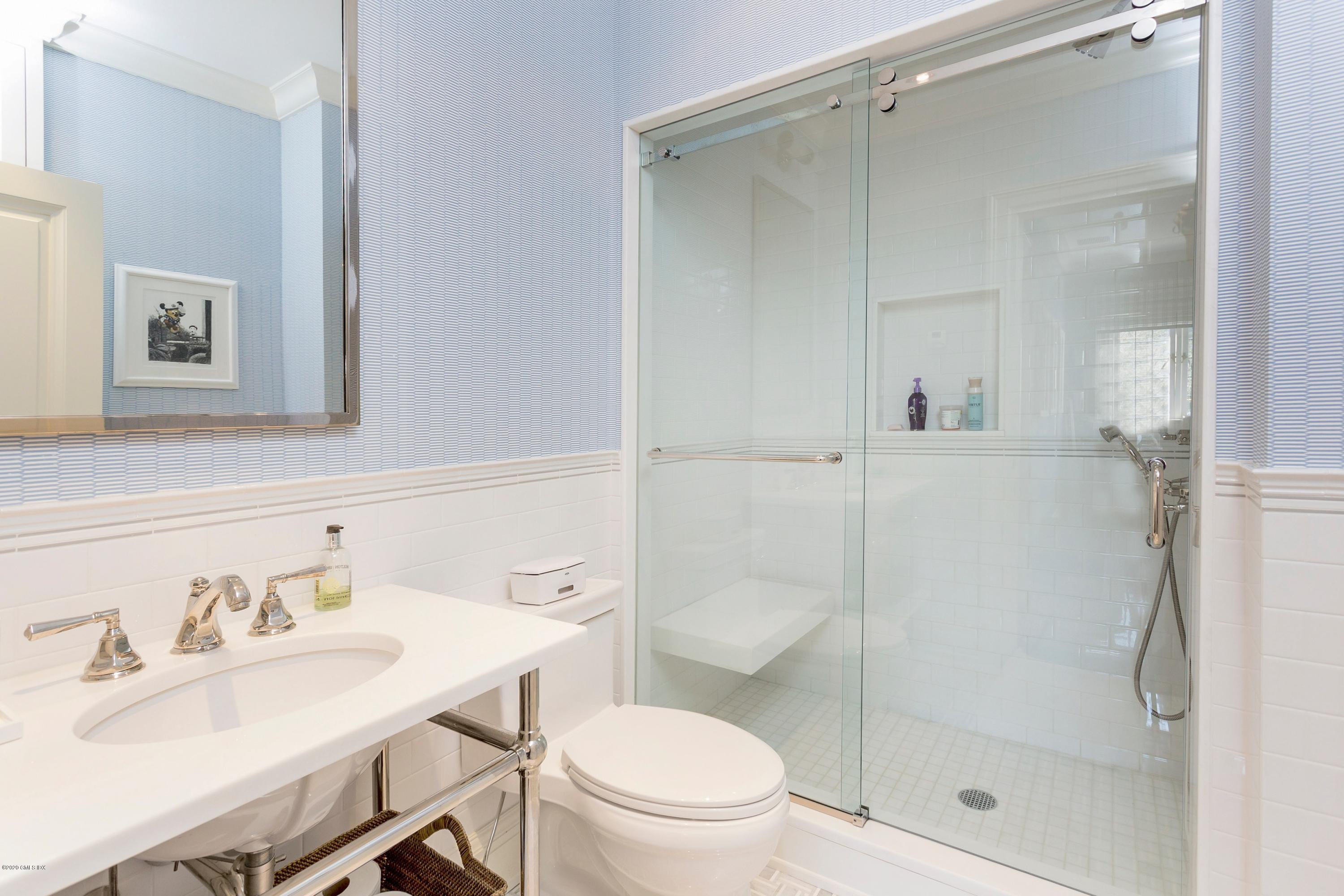 2 Broad Road Greenwich, CT 06830 - Photo 30 of 39 a bathroom with a sink toilet a mirror and shower