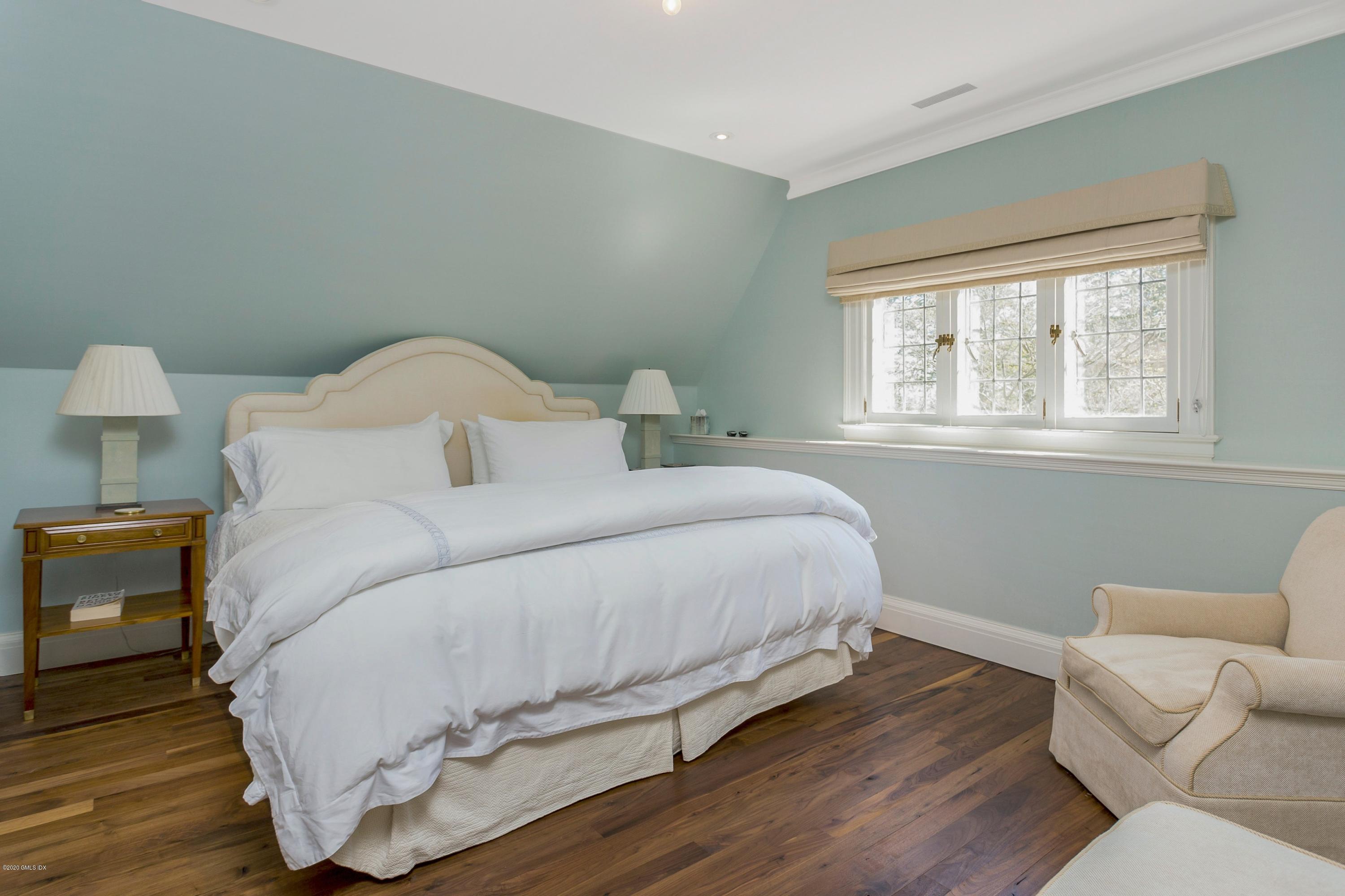 2 Broad Road Greenwich, CT 06830 - Photo 31 of 39 a large white bed in a room next to a window