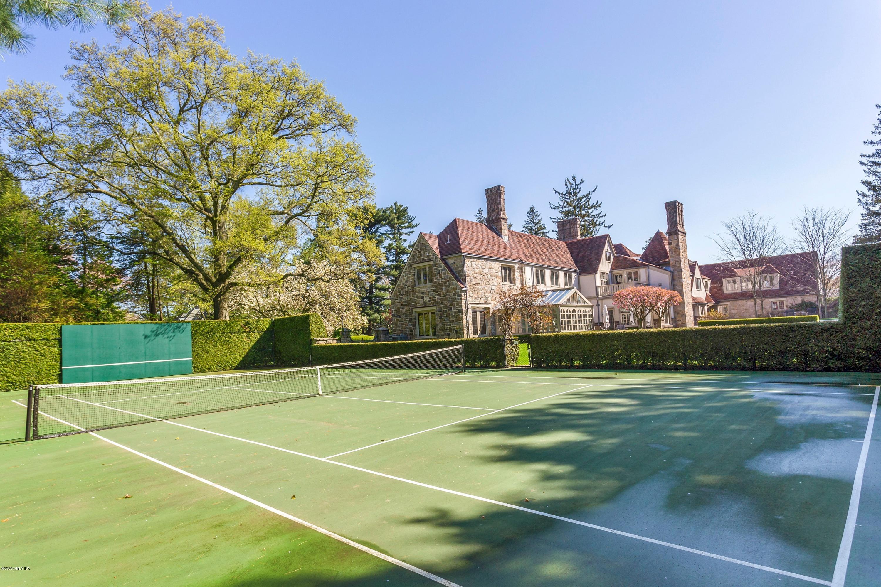 2 Broad Road Greenwich, CT 06830 - Photo 34 of 39 a view of a tennis ground with large trees