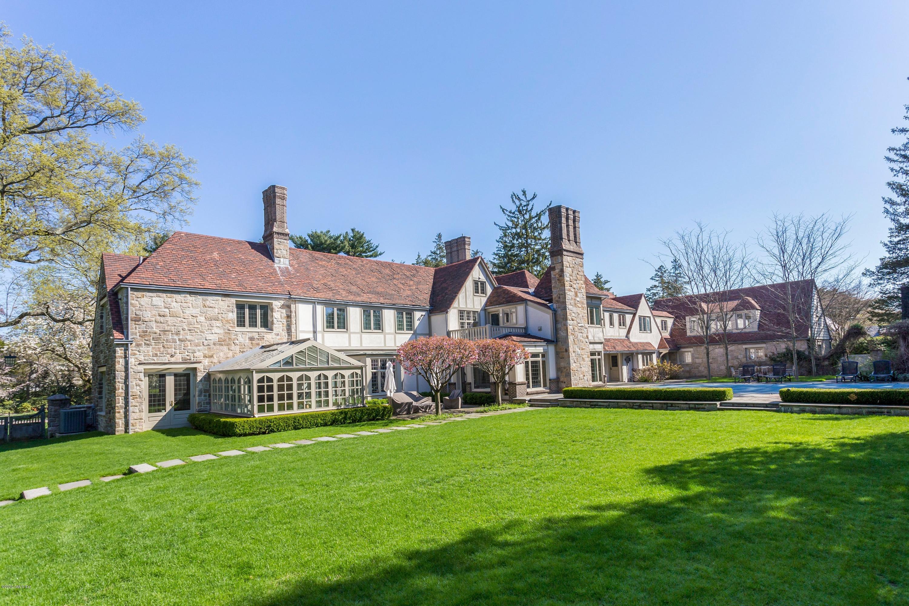 2 Broad Road Greenwich, CT 06830 - Photo 35 of 39 a front view of a house with a yard