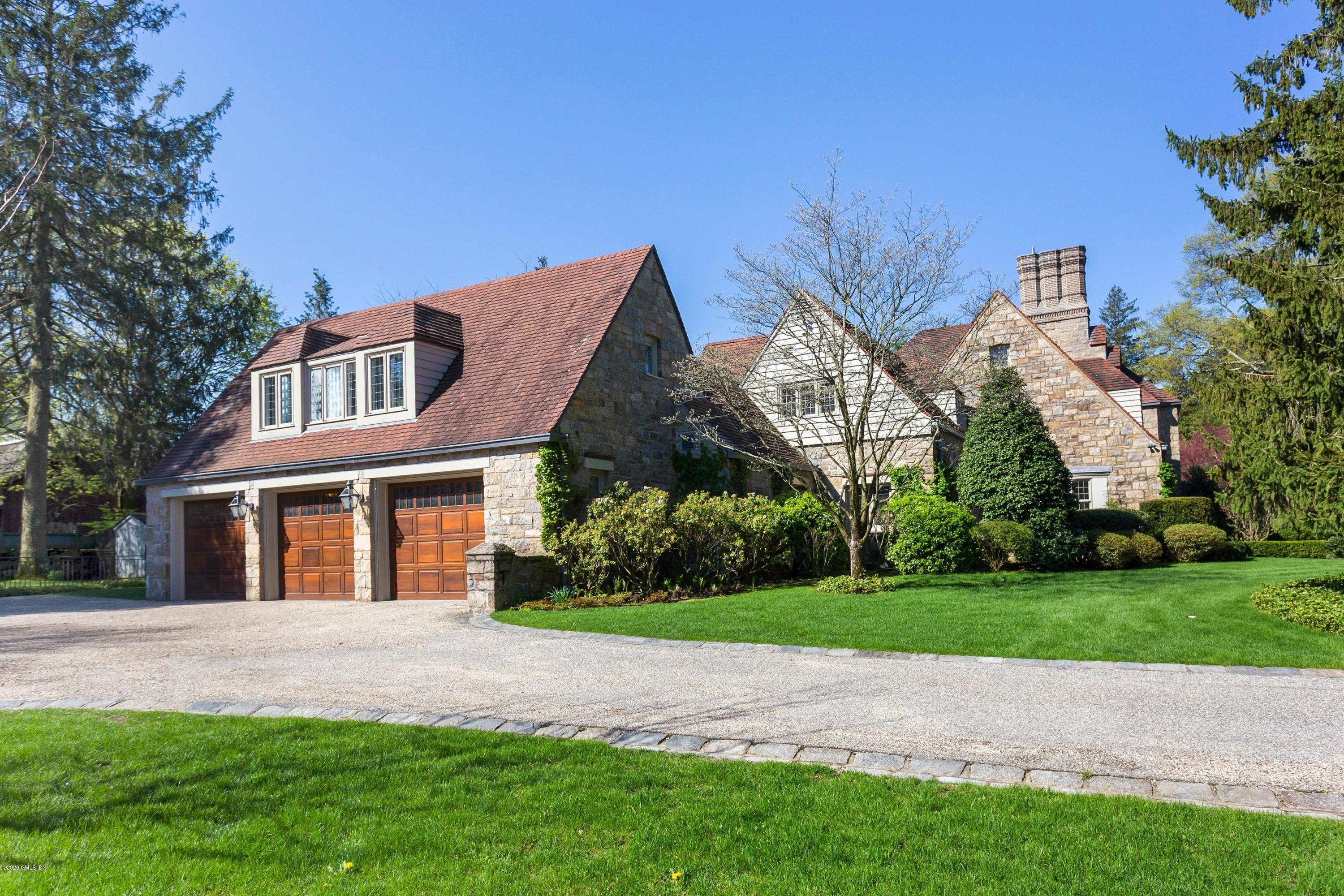 2 Broad Road Greenwich, CT 06830 - Photo 7 of 39 a front view of house with yard and green space