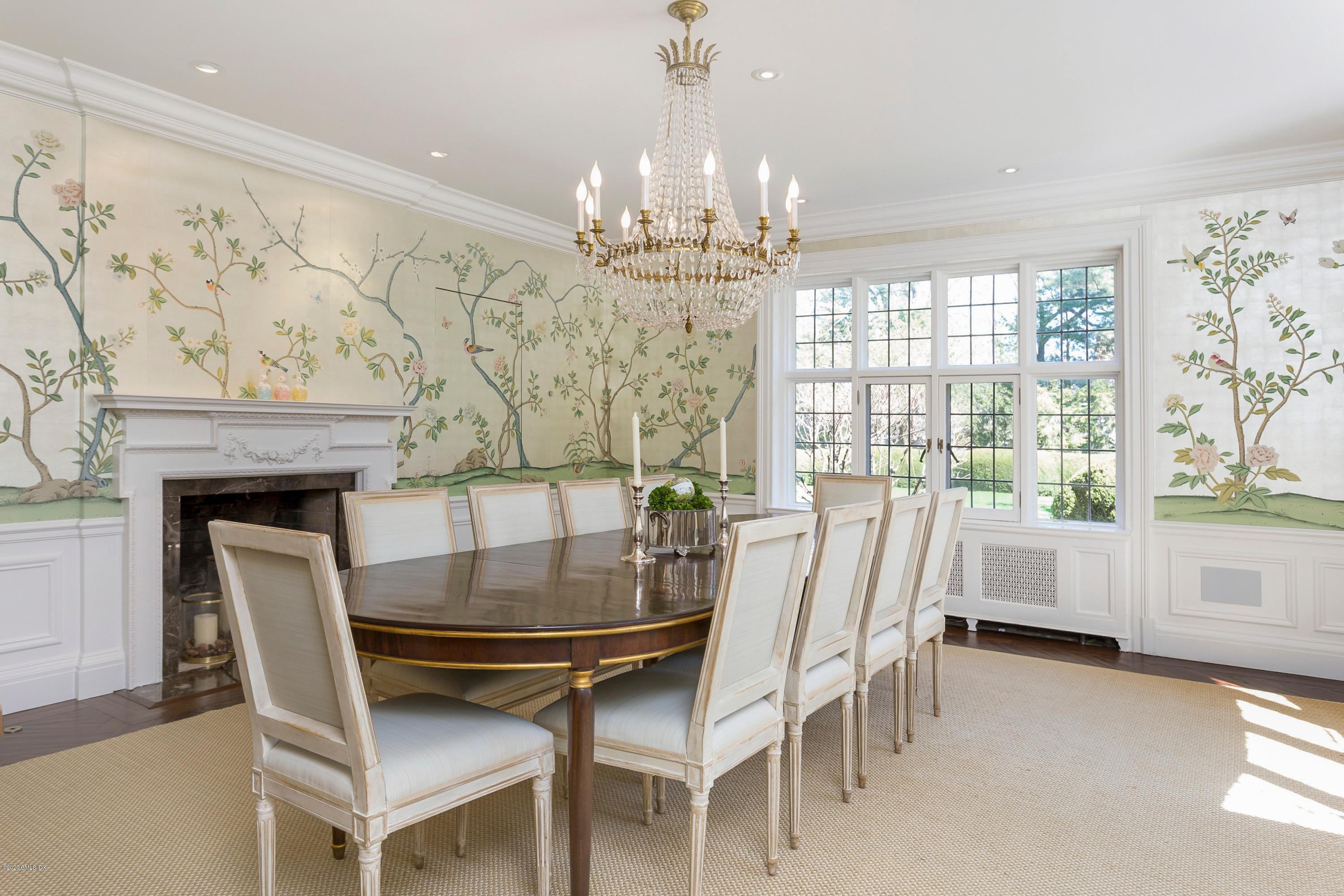2 Broad Road Greenwich, CT 06830 - Photo 10 of 39 a dining room with furniture a chandelier and wooden floor