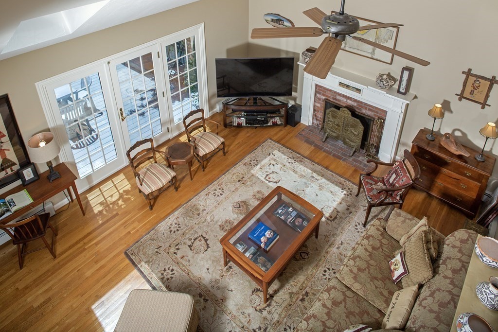 130 Union Bridge Road Duxbury, MA 02332 - Photo 13 of 33 a living room with furniture and a fireplace