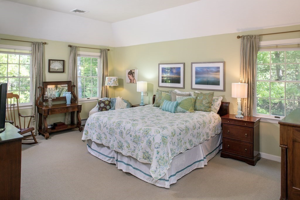 130 Union Bridge Road Duxbury, MA 02332 - Photo 20 of 33 a bed sitting in a bedroom next to a window