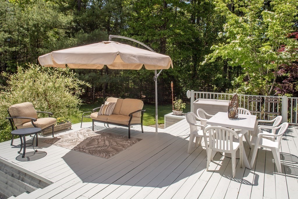 130 Union Bridge Road Duxbury, MA 02332 - Photo 25 of 33 a view of a table and chairs on the deck