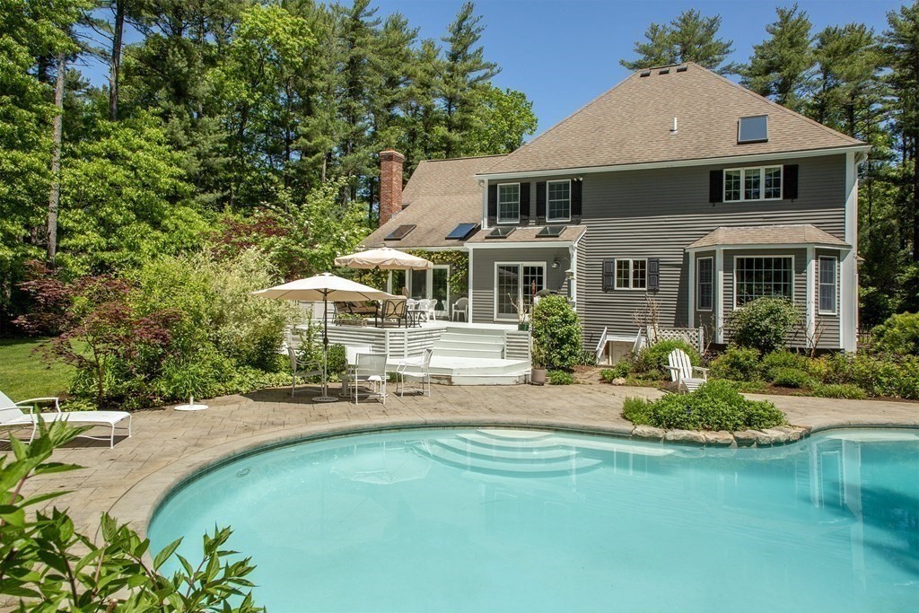 130 Union Bridge Road Duxbury, MA 02332 - Photo 29 of 33 a front view of a house with a yard table and chairs