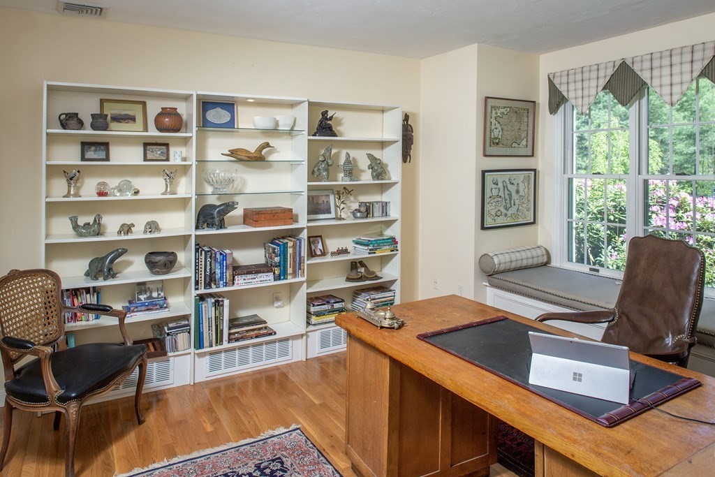130 Union Bridge Road Duxbury, MA 02332 - Photo 4 of 33 a view of a workspace with furniture and a bookshelf