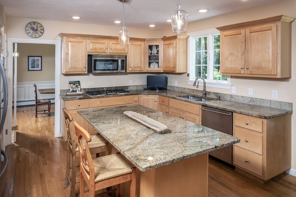 130 Union Bridge Road Duxbury, MA 02332 - Photo 9 of 33 a kitchen with stainless steel appliances granite countertop wooden cabinets and a counter top space
