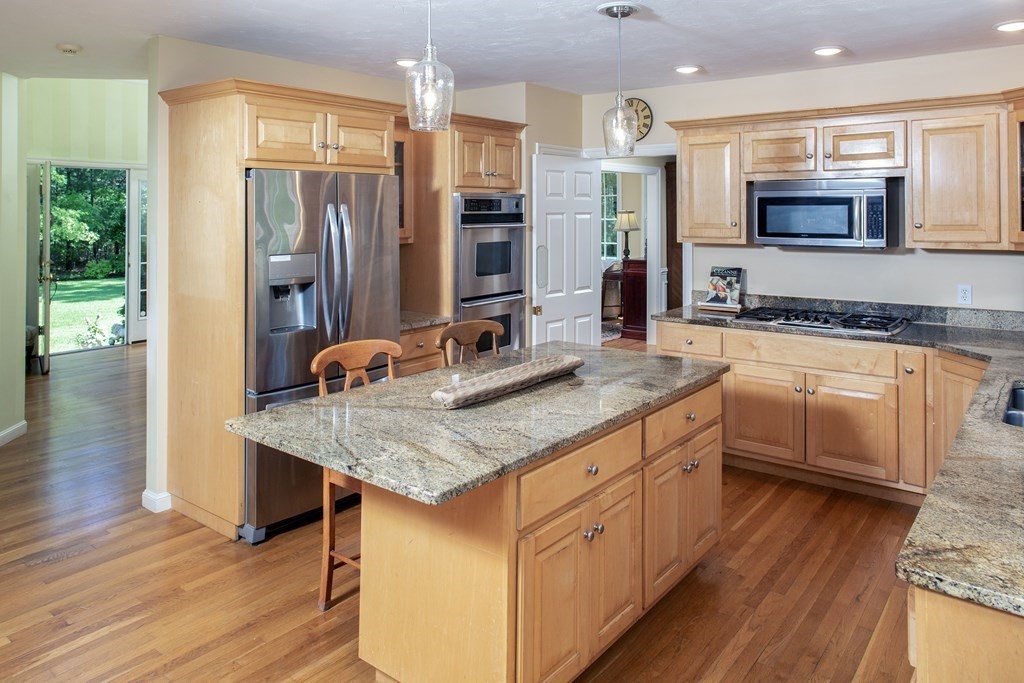 130 Union Bridge Road Duxbury, MA 02332 - Photo 10 of 33 a kitchen with stainless steel appliances granite countertop a sink stove and refrigerator