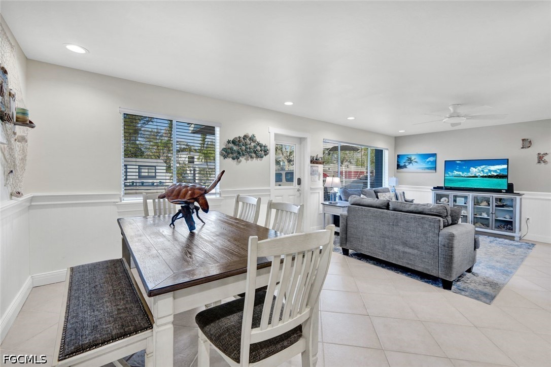 4830 Coquina Road Fort Myers Beach, FL 33931 - Photo 14 of 30 a living room with furniture and a flat screen tv