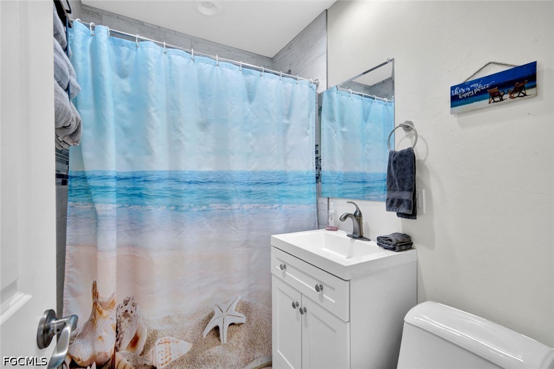 4830 Coquina Road Fort Myers Beach, FL 33931 - Photo 19 of 30 a bathroom with a sink toilet and shower