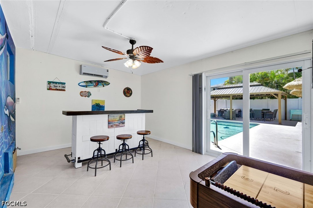 4830 Coquina Road Fort Myers Beach, FL 33931 - Photo 23 of 30 a living room with furniture and a large window