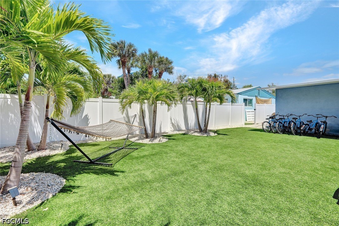 4830 Coquina Road Fort Myers Beach, FL 33931 - Photo 27 of 30 a view of a backyard with a garden