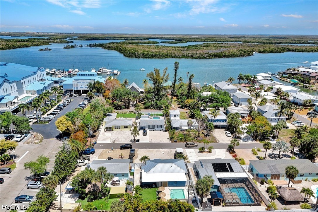 4830 Coquina Road Fort Myers Beach, FL 33931 - Photo 28 of 30 an aerial view of ocean with residential house with lake view