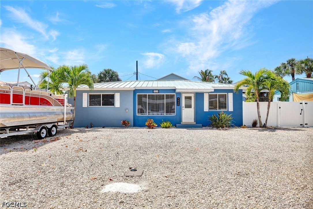 4830 Coquina Road Fort Myers Beach, FL 33931 - Photo 30 of 30 a front view of a house with a yard