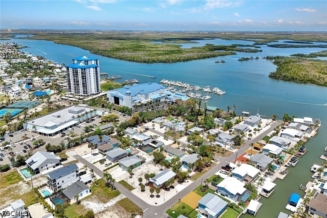 4830 Coquina Road Fort Myers Beach, FL 33931 - Photo 6 of 30 an aerial view of ocean and residential houses with outdoor space