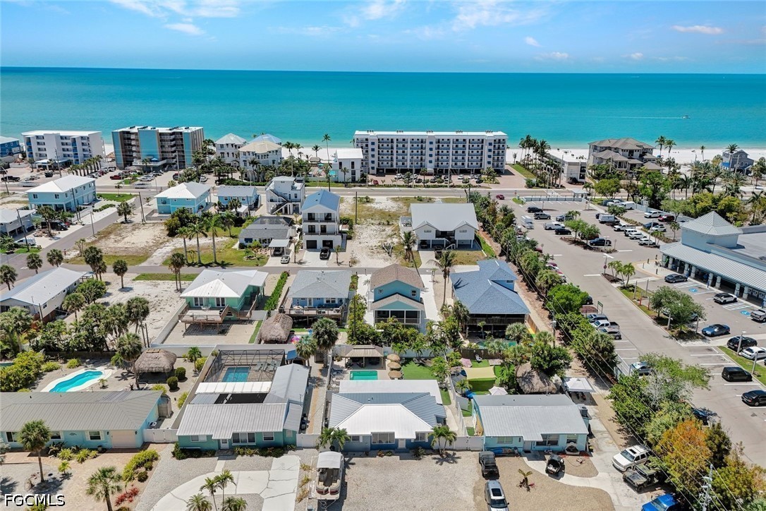 4830 Coquina Road Fort Myers Beach, FL 33931 - Photo 7 of 30 an aerial view of a city with ocean view