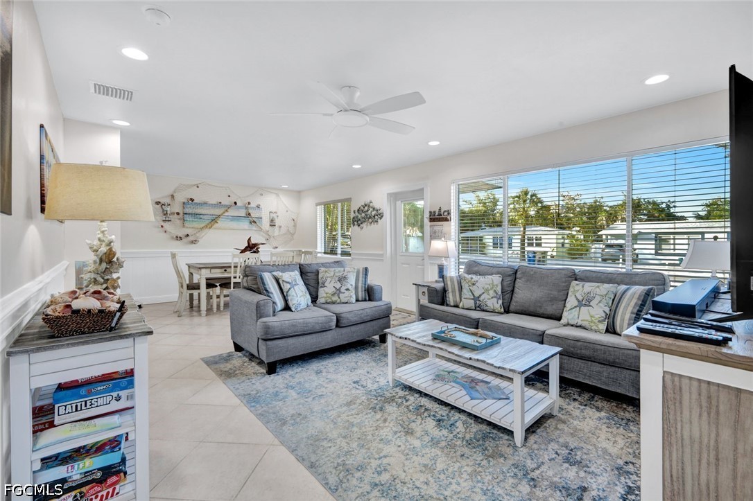 4830 Coquina Road Fort Myers Beach, FL 33931 - Photo 9 of 30 a living room with furniture and a large window