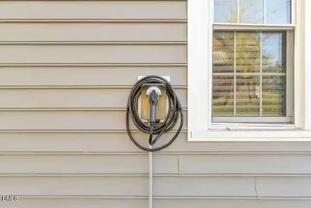 a bathroom with a window and a shower