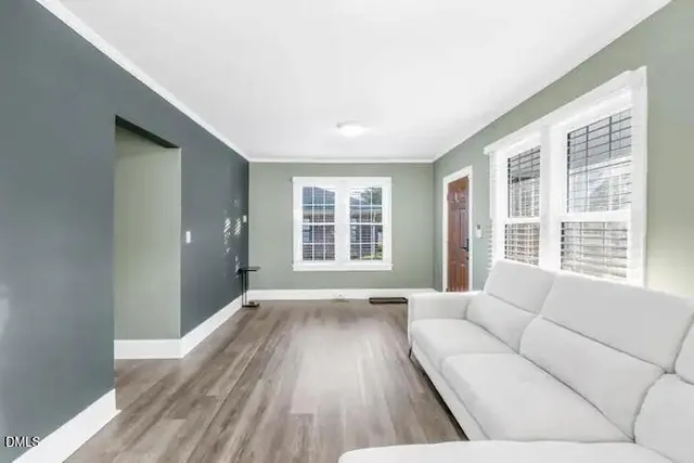 a living room with furniture and windows