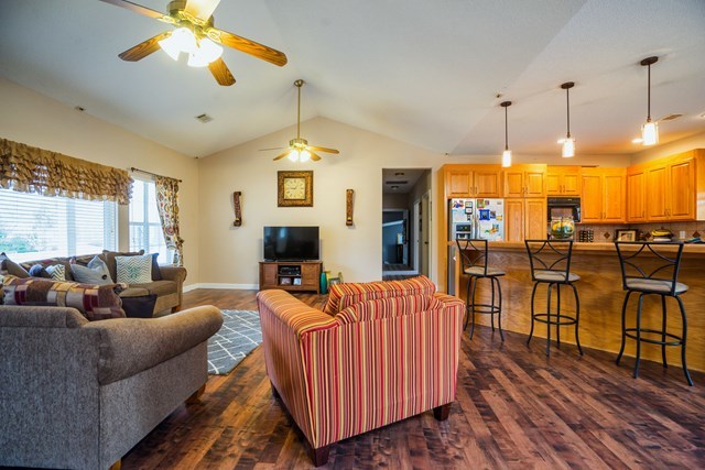 1267 Johnson Road Macon, GA 31220 - Photo 2 of 20 a living room with furniture a chandelier and a dining table