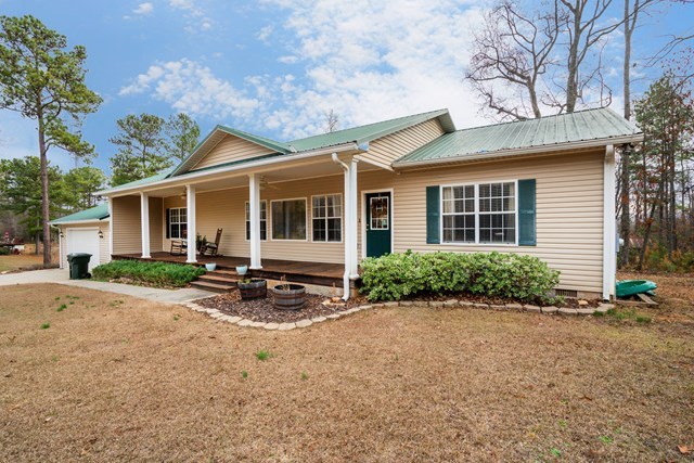 1267 Johnson Road Macon, GA 31220 - Photo 19 of 20 a view of a house with backyard sitting area and garden