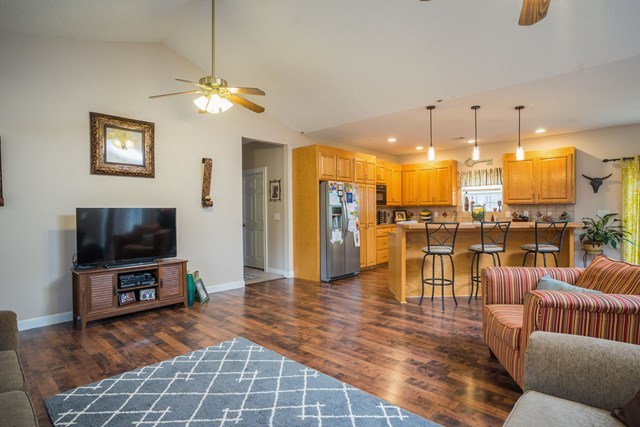 1267 Johnson Road Macon, GA 31220 - Photo 6 of 20 a living room with furniture a flat screen tv and kitchen view