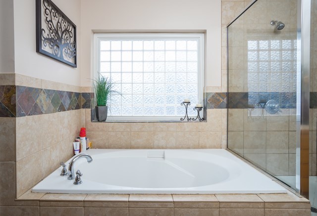 1267 Johnson Road Macon, GA 31220 - Photo 8 of 20 a bathroom with a bathtub and next to a window