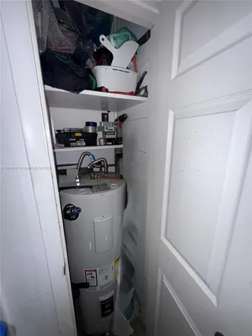 a bathroom with a toilet and a shower curtain