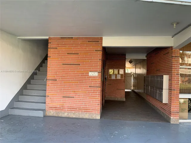 a view of a house with swimming pool and sitting area